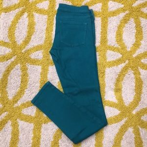 Green skinny jeans